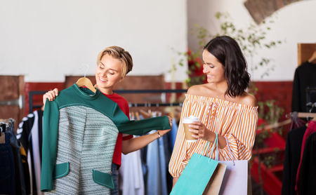 women choosing clothes at vintage clothing storeの写真素材