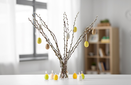 pussy willow branches decorated by easter eggsの写真素材