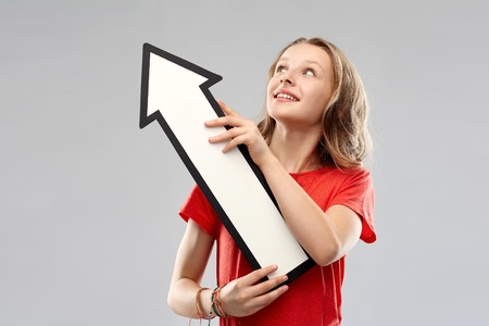 teenage girl with arrow shows north west direction