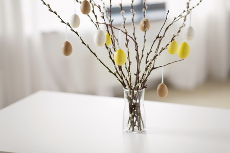 pussy willow branches decorated by easter eggs