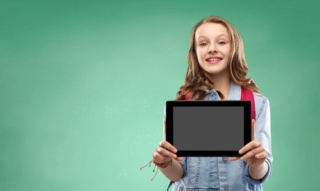 Student girl with school bag and tablet computerの写真素材