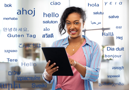 happy african american woman using tablet pcの写真素材