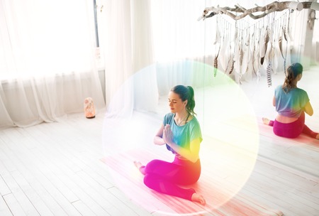 A woman meditating at yoga studio