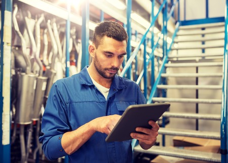 car service, repair, maintenance and people concept - auto mechanic man or smith with tablet pc...