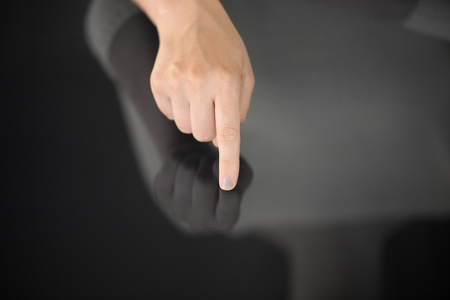 hand using black interactive panelの写真素材