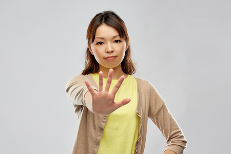 young asian woman showing stop gestureの写真素材