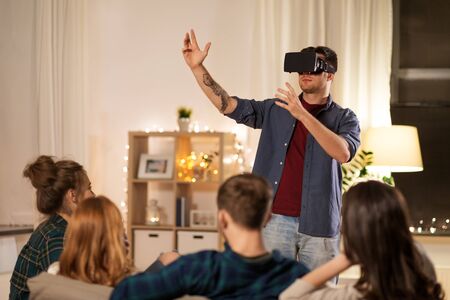 man in vr glasses at home with friends