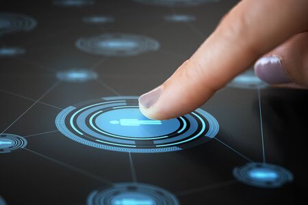 Finger touching network icon on interactive panelの写真素材