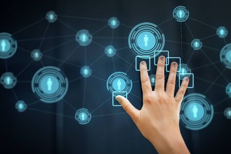 Hand using interactive panel with network icons