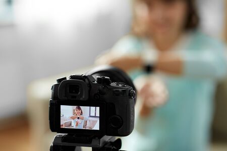 asian blogger makes video blog of smart watchの写真素材