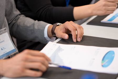 hands of businessman at business conference