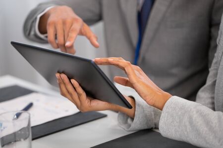 people with tablet computer at business conferenceの写真素材