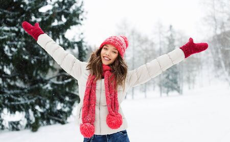 happy young woman in winter parkの写真素材