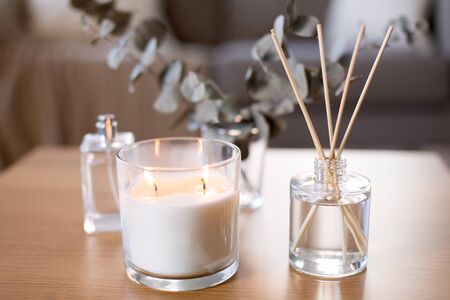 aroma reed diffuser, burning candle and perfume