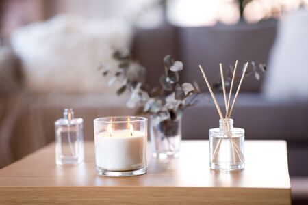 aroma reed diffuser, burning candle and perfume