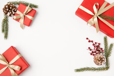 christmas gifts and fir branches with pine conesの写真素材