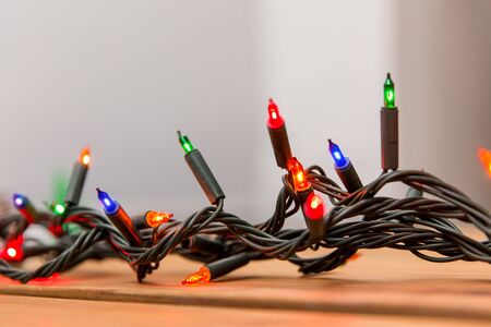 christmas garland lights on wooden background