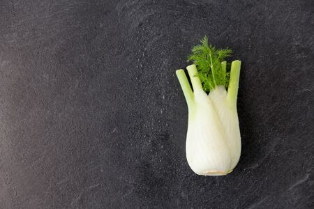 vegetable, food and culinary concept - fennel on slate stone backgroundの写真素材