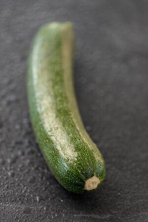 zucchini on slate stone backgroundの写真素材