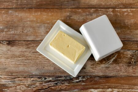 close up of butter on wooden table