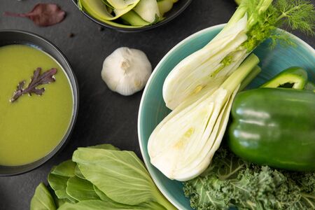 green vegetables and cream soup in ceramic bowlの写真素材