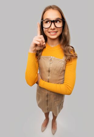 smiling teenage student girl in glassesの写真素材