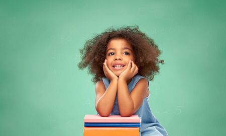 little african american schoolgirl with booksの写真素材