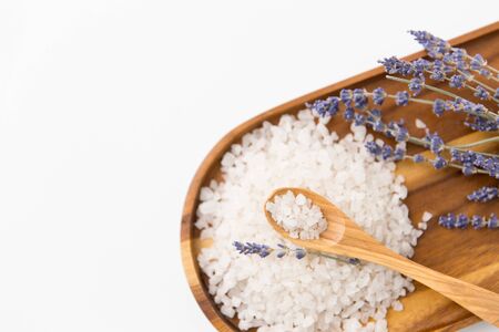 sea salt heap, lavender and spoon on wooden trayの写真素材