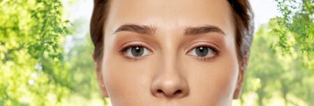 close up of beautiful young woman face and eyes