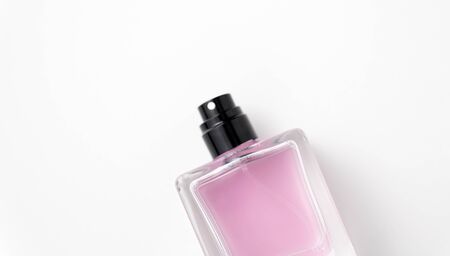 fragrance and aroma concept - bottle of perfume or pink toilette water on white backgroundの写真素材