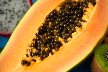 fruits, diet and food concept - close up of ripe papaya with seedsの写真素材