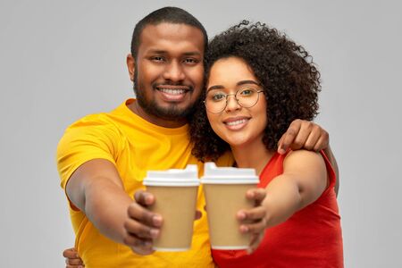 happy african american couple with coffee cups