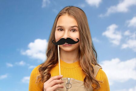 teenage girl with black moustaches party accessory