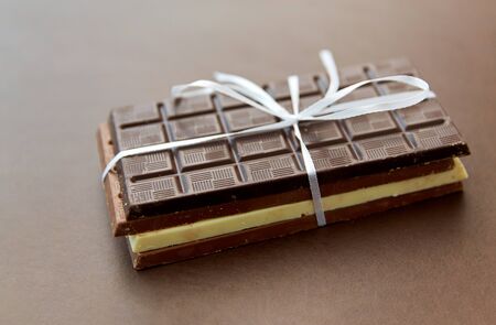 different kinds of chocolate on brown backgroundの写真素材