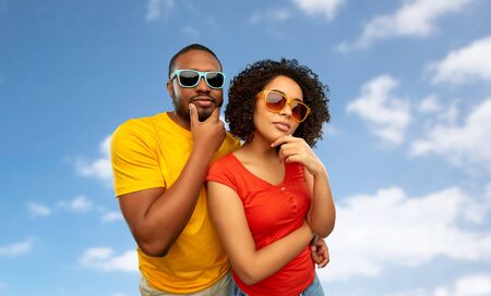 african couple in sunglasses thinkingの写真素材