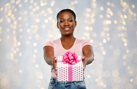 happy african american woman with birthday present