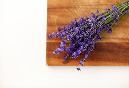 bunch of lavender flowers on wooden boardの写真素材