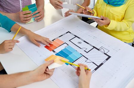 close up of architects team working with blueprint