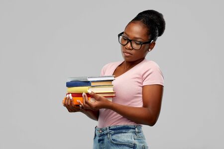 african american woman with booksの写真素材