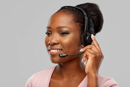 african american woman in headset with microphone