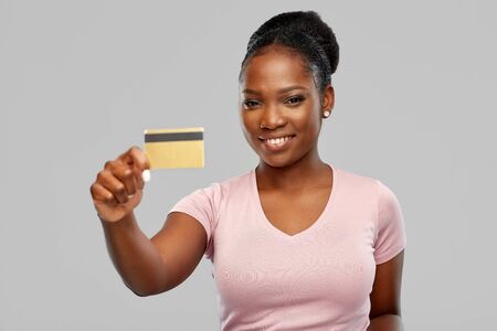 happy african american woman with credit cardの写真素材