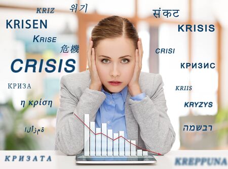 stressed businesswoman with tablet pc in crisisの写真素材