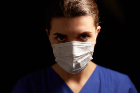 female doctor or nurse in medical face maskの写真素材