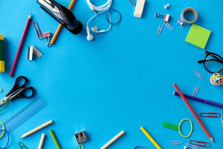 stationery or school supplies on blue background