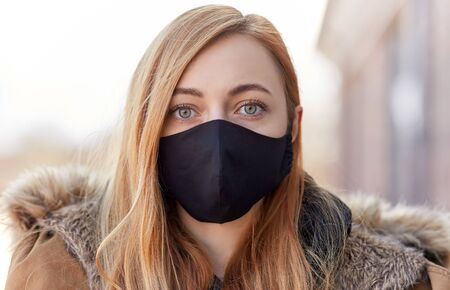 woman wearing protective reusable barrier mask