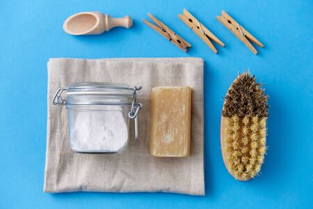 brush, washing soda, soap, scoop and clothespins
