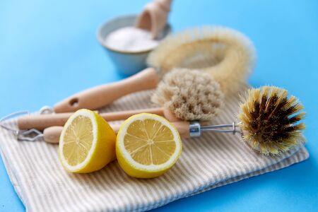 cleaning brushes, lemon and washing soda on clothの写真素材