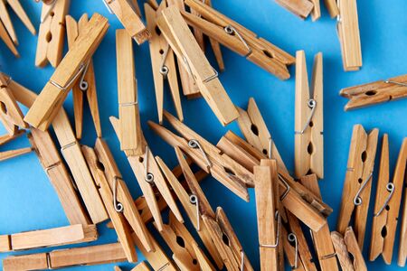 close up of wooden clothespins on blue backgroundの写真素材