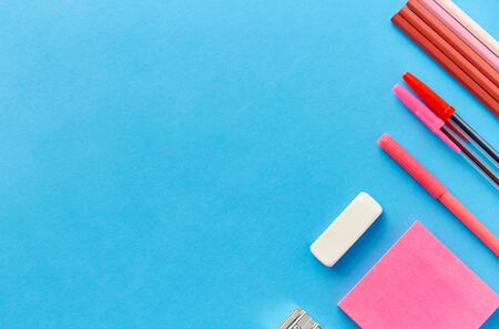 pink sticky notes, pens, pencils, clips and eraser