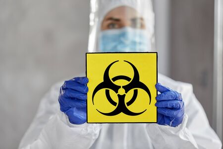 doctor in protective wear, mask and face shieldの写真素材